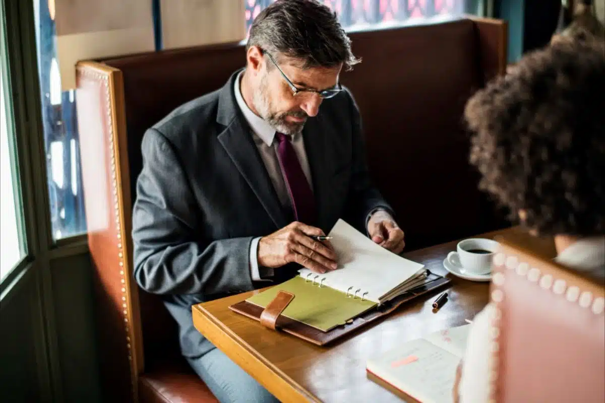 Businessman signing contract with client